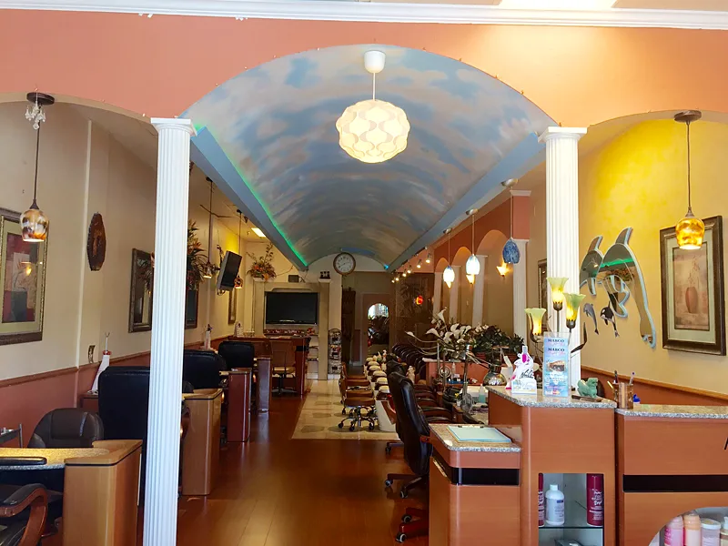 Inside Marco Nail Spa: an arched, painted-sky ceiling over the manicure and pedicure stations
